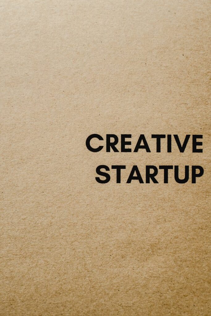 Minimalist brown paper background with 'Creative Startup' text, suitable for business themes.